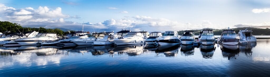 Boats and yachts docked by the bay

